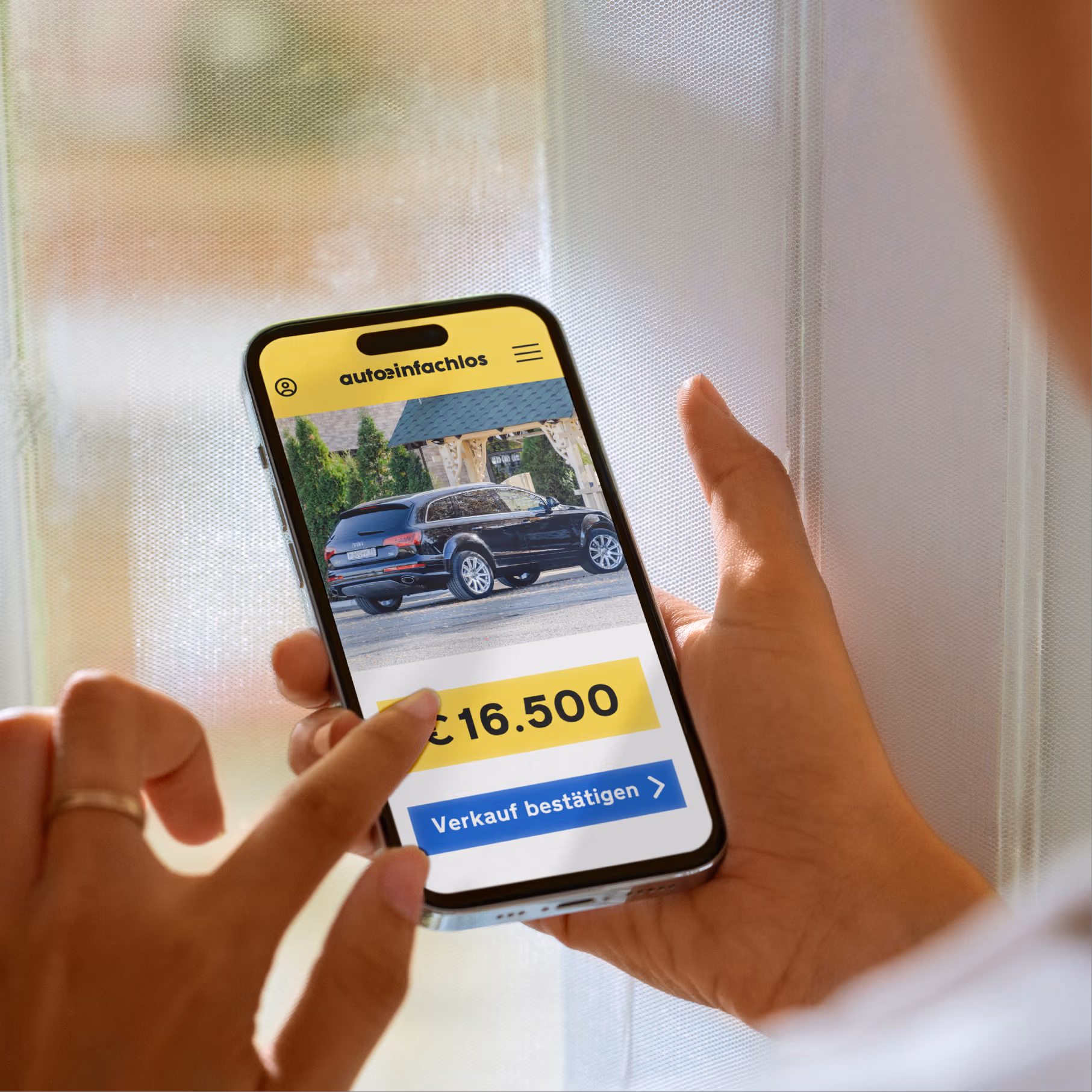 Ein Smartphone mit einem Verkaufsangebot für ein Auto, als Alternative zur Plattform Wir kaufen dein Auto